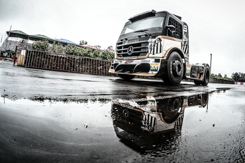 canal, tire, transportation, puddle, rain, water, nautical vessel, trucks, day, land vehicle, wheel, waterfront, black, sky, vehicle, rainy season, mode of transportation