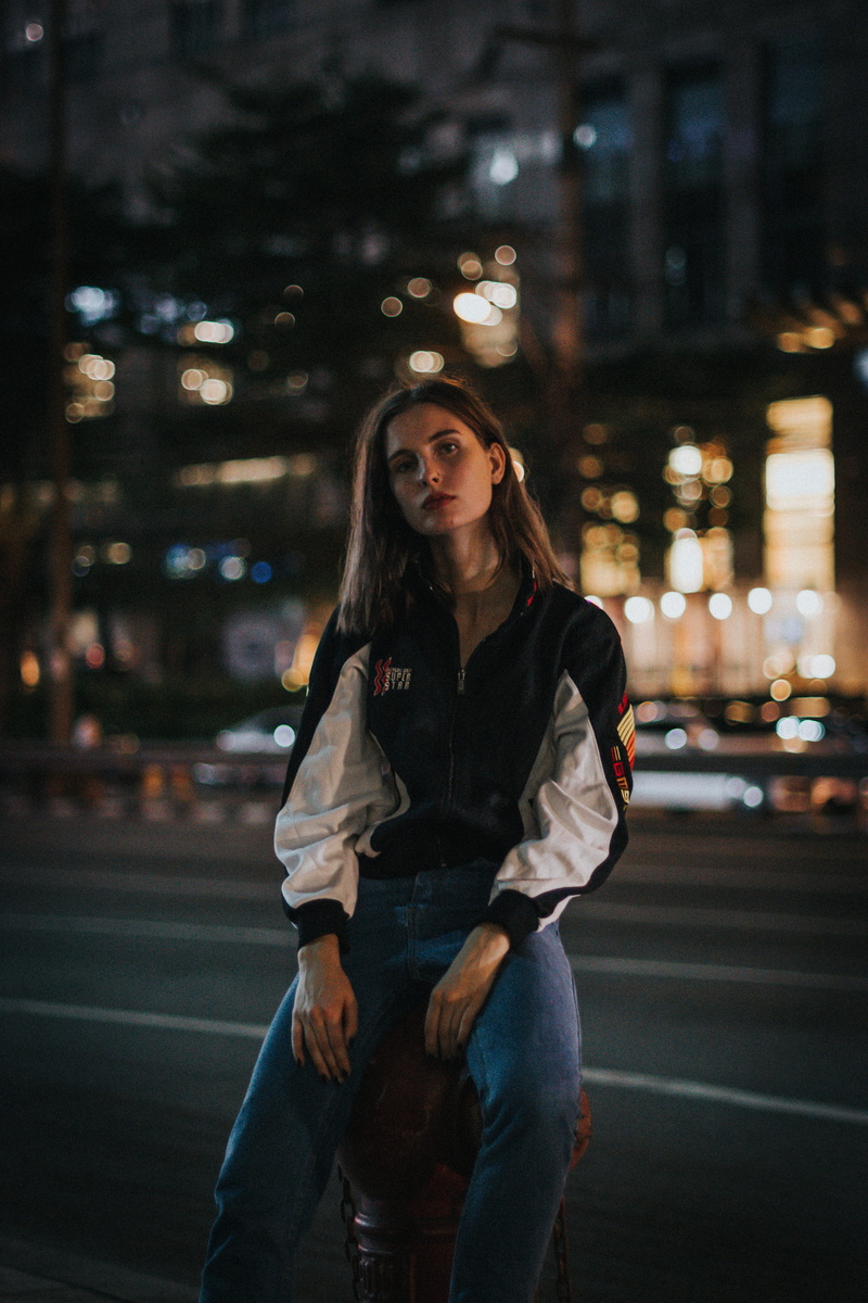 architecture, human, retro, pose, person, lifestyles, sat, leather jacket, focus on foreground, female, real people, jacket, moody, portrait, fashion, young women