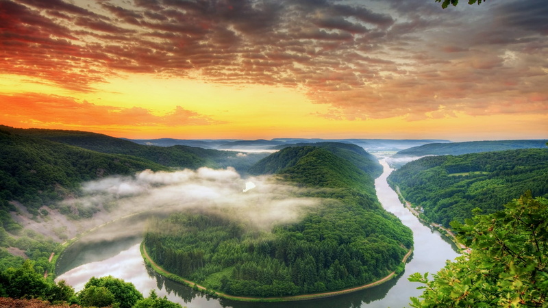 flowing, pine trees, sunset, orange color, green, plant, tranquil scene, island, beauty in nature, hills, flowing water, clouds, sea, leaves, sky, water