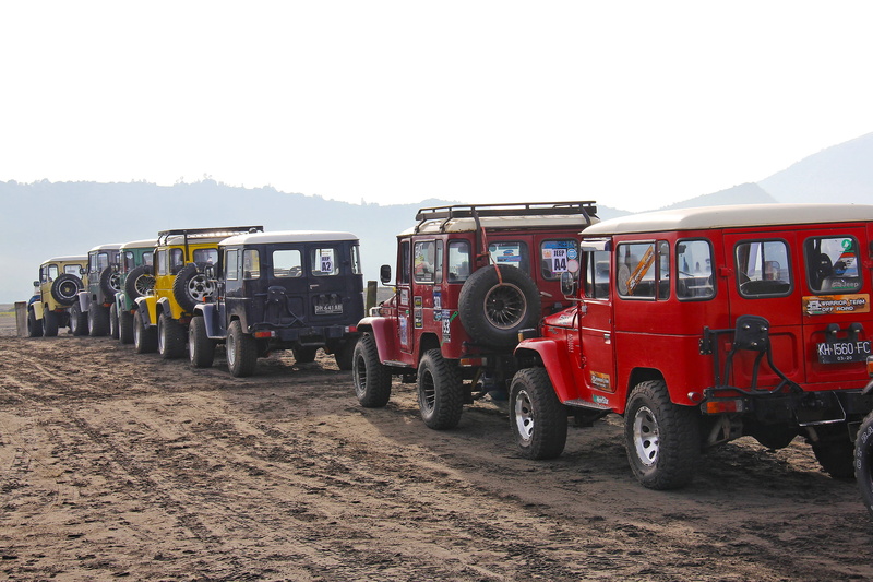 fast, occupation, driving, nature, motor vehicle, soil, travel, outdoors, indonesia, mode of transportation, semi-truck, jeep, land, red, day, incidental people