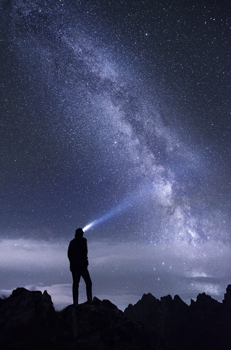 person, one person, galaxy background, headlight, galaxy, space background, man, star field, space, real people, mountain, beauty in nature, night, headlamp