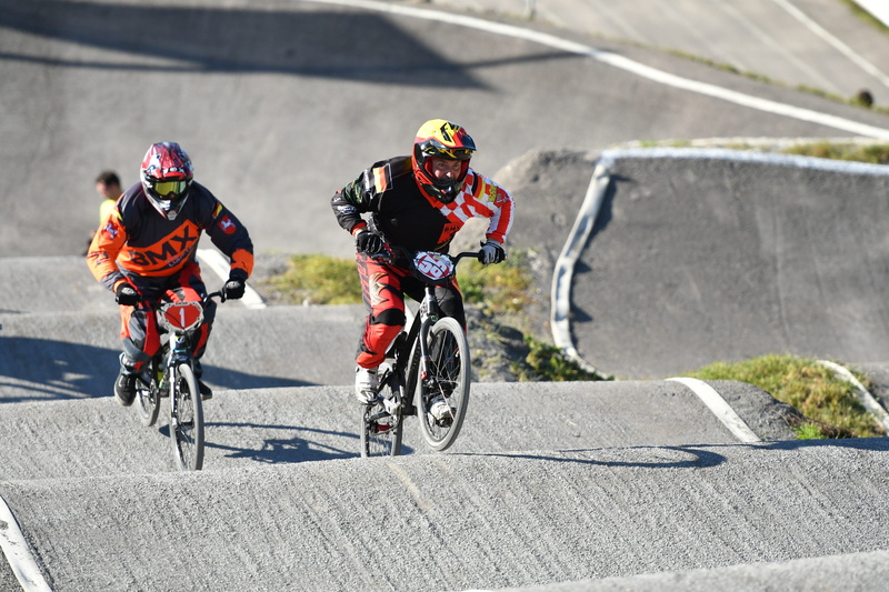 outdoors, effort, germany, race, motion, headwear, transportation, real people, on the move, sports helmet, men, helmet, day, action, rad-bundesliga, riding
