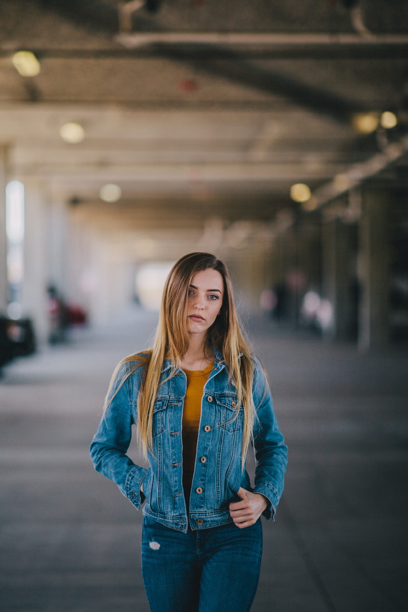 yellow, focus on foreground, women, middle, blue, road, focus, architecture, brunette, standing, winter, hairstyle, denim, young adult, selective, front view