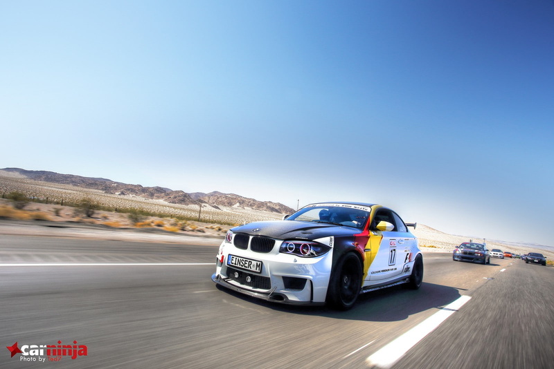 car, blue, sign, land vehicle, travel, on the move, copy space, motor vehicle, motion, auto racing, road trip, clear sky, speed, blurred motion, mode of transportation