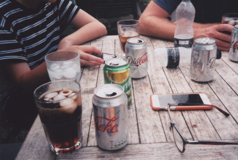 person, togetherness, people, drink, cheddar gorge, leisure activity, alcohol, can, communication, holding, cheddar, sitting, table, lifestyles, coca cola