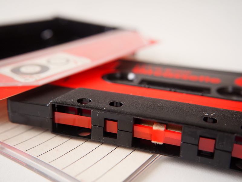 slumbering, arts culture and entertainment, wireless technology, 4K, audio cassette, communication, technology, equipment, eighties, black color, group of objects