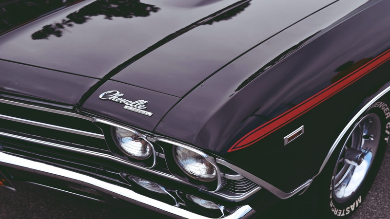 black color, retro styled, headlight, wheel, close-up, western script, no people, high angle view, outdoors, day, 1080P, vintage, reflection, silver colored