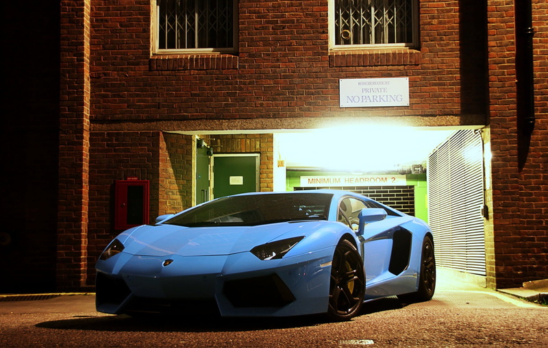 architecture, luxury, transportation, brick wall, building exterior, land Vehicle, car, city, technology, urban Scene, street, red, motor vehicle, day