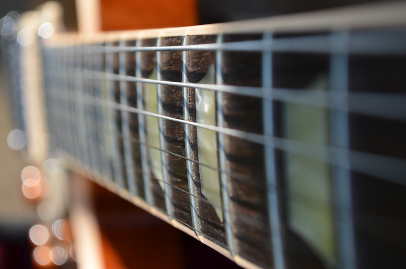 outdoors, guitar, string, strap, string instrument, leisure activities, lute, musical instrument, acoustic guitar, snow, grille, electric, shelf, musical equipment