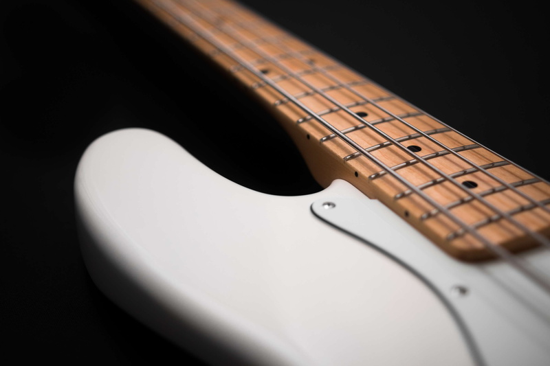 no people, musical instrument, electric guitar, bass guitar, e bass, wood - material, studio shot, instrument, selective focus, close-up, indoors, fretboard