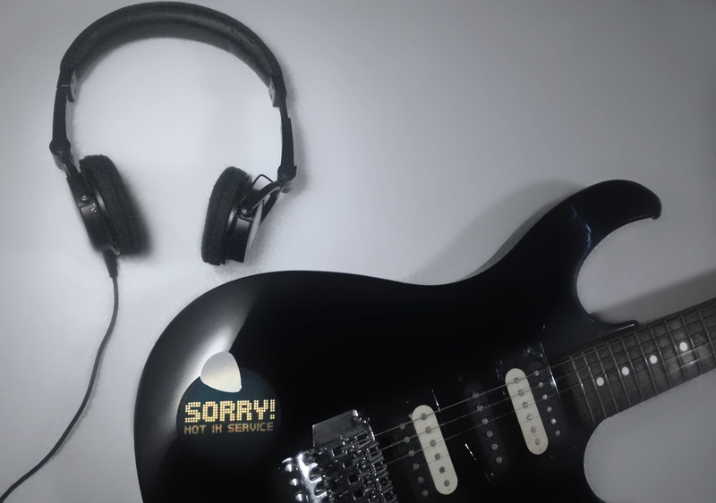 arts culture and entertainment, bw, electric guitar, no people, close-up, rock music, six strings, listening, modern rock, single object, headphone, still life