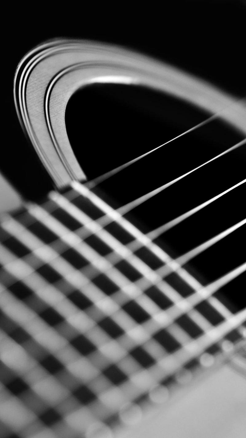 selective focus, rock music, indoors, creativity, noise, string, acoustic guitar, dark, black background, musical instrument, guitar, fretboard, classical