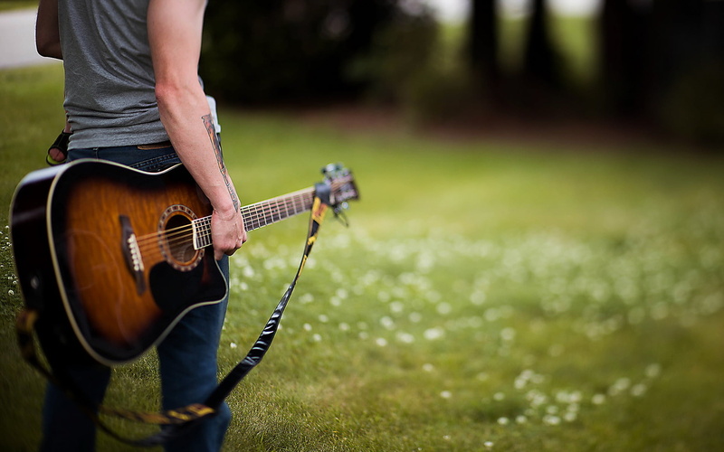 practicing, brown, guy, arts culture and entertainment, acoustic, sunlight, grass, focus on foreground, casual Clothing, nature, males, summer, guitarist