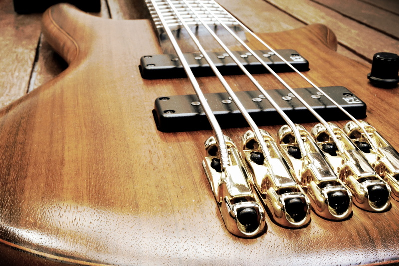 arts And Entertainment, man made, indoors, electric bass, bass, strings, wood - Material, wind instrument, harmony, fretboard, high angle view, close-up