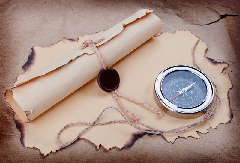 letter, navigational compass, star shape, drink, concepts, map, direction, high angle view, paper, nature, manuscript, candle, container, wood - Material
