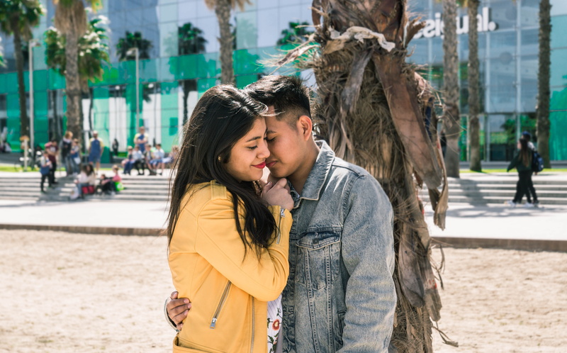 togetherness, young adult, vacation, hug, real people, city, urban, two people, dating, apparel, day, face, incidental people, leisure activity, jeans