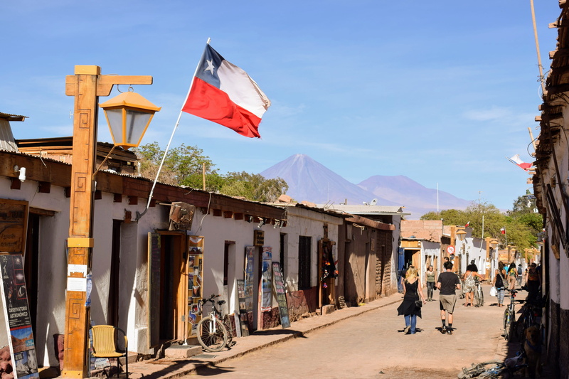 architecture, mountain, 4K, chile, flag, walking, street, desert, patriotism, city, san pedro, outdoors, house, sunlight, group of people, san pedro de atacama