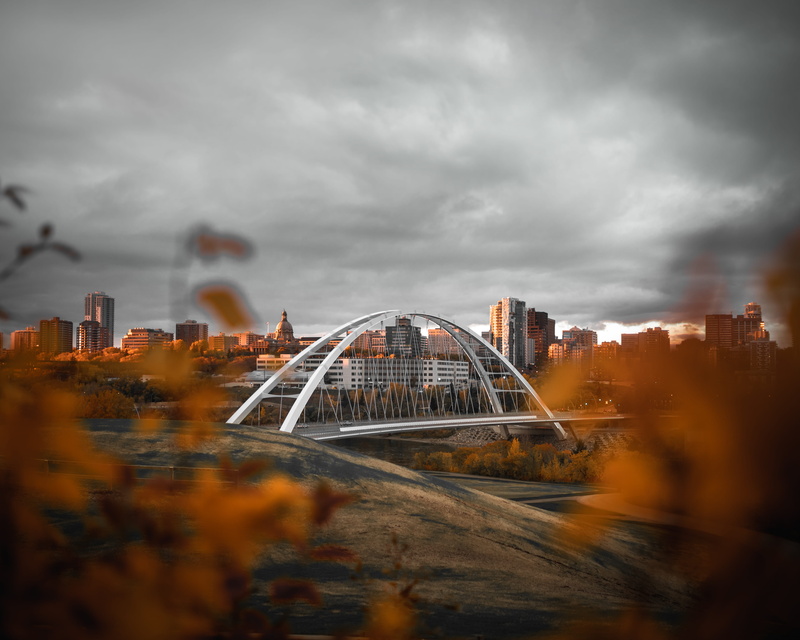 no people, travel destinations, scenery, outdoors, skyscraper, dark, architecture, dome, storm, motion, town, sky, built structure, cityscape, edmonton