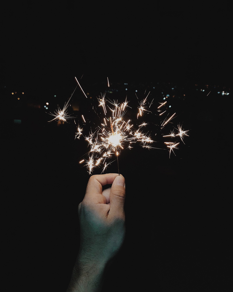 body part, light, spark, firework - man made object, human limb, black background, estrella 520, firework display, finger, holding, human body part, fire