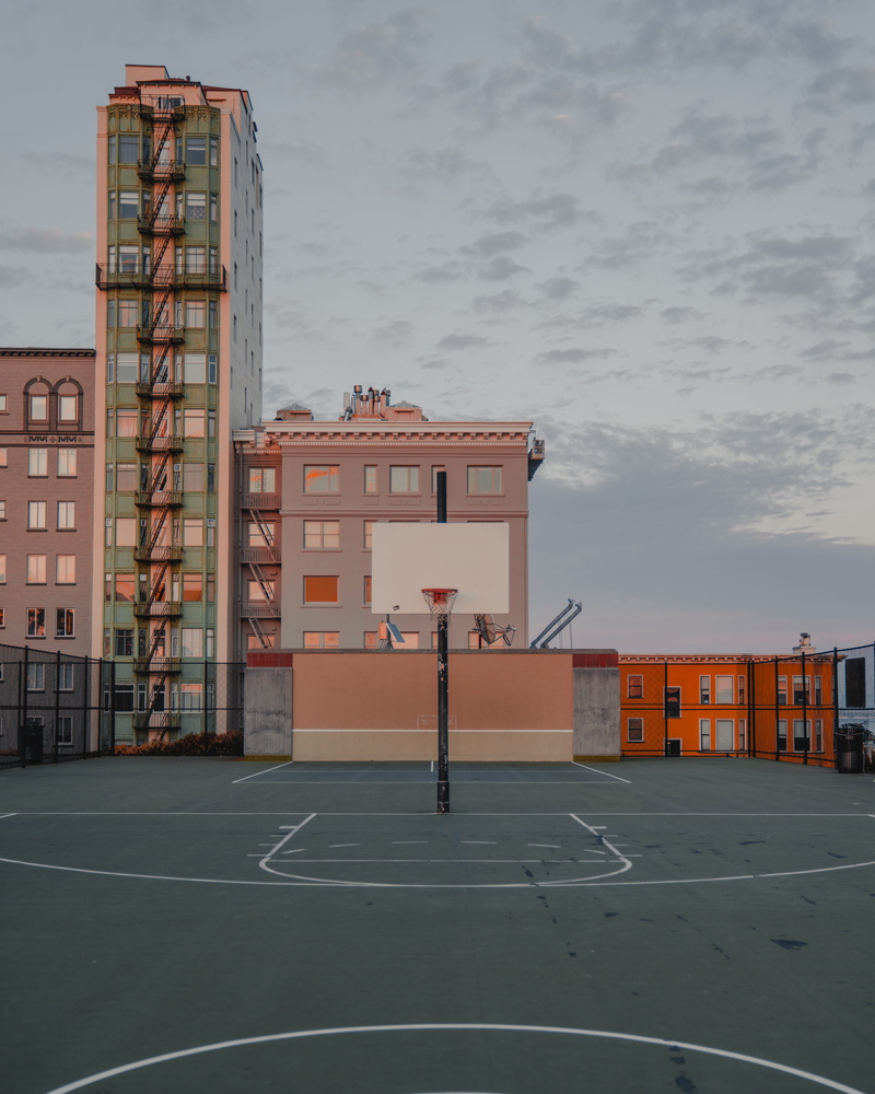 building exterior, no people, team sport, pink, architecture, colors, park, day, hoops, apartment, city, court, built structure, sport, industry, building