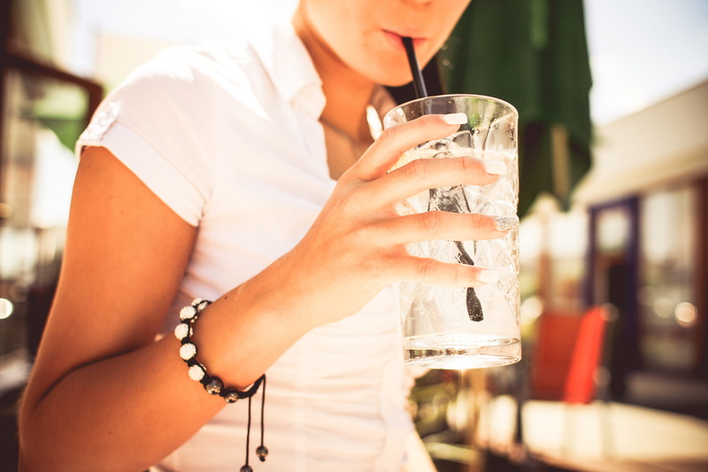 bar - Drink Establishment, women, one Person, young Women, refreshment, city Life, young Adult, glass, day, drinking Glass, caucasian Ethnicity, holding