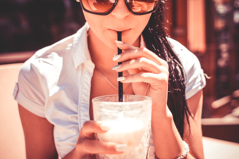 drinking Glass, sitting, relaxation, household equipment, glass, drinking straw, indoors, Girl, smiling, adults Only, glasses, holding, alcohol, enjoyment