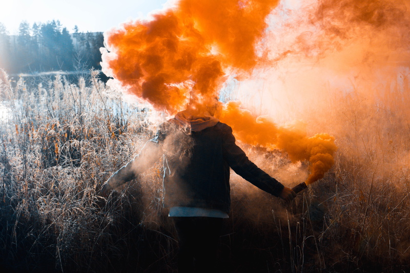 flare, 5K, outdoors, person, smoke - physical structure, communication, warning sign, pollution, flame, adult, torchlight, field, fire - natural phenomenon