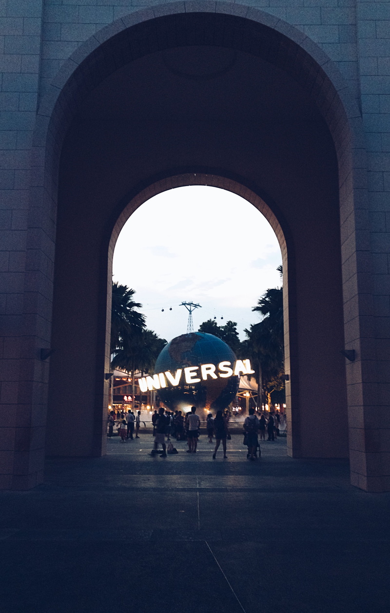 universal ball, adult, mammal, outdoors, singapore, sky, street, universal, architecture, domestic, dark, crowd, built structure, blue, group of people