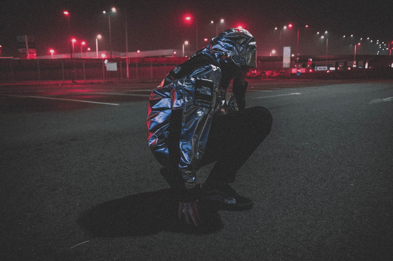 full length, hypebeast, urban, red, light, warm clothing, casual clothing, one person, north face, lifestyles, clothing, transportation, standing, obscured face