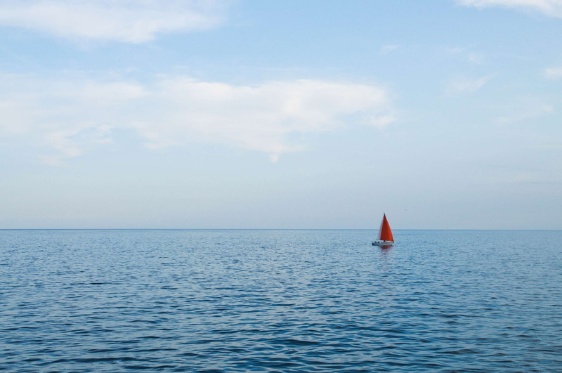 waterfront, nautical vessel, non-urban scene, boat, idyllic, beauty in nature, sky, tranquil scene, nature, horizon over water, floating on water, blue