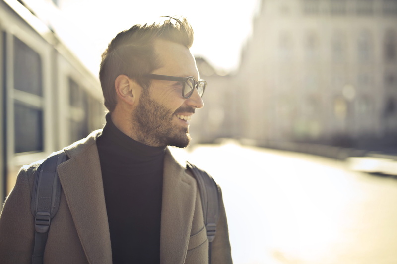 urban, 30-35 years old, shoulders, black sweater, showing, young adult man, headshot, travel, sunglasses, standing, white, portrait, outdoors, looking