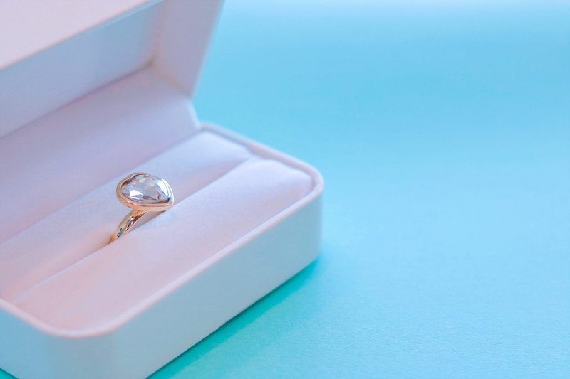 engagement, diamond ring, colored background, precious gem, jewelry box, expense, ring, swimming pool, indoors, wealth, silver colored, turquoise colored