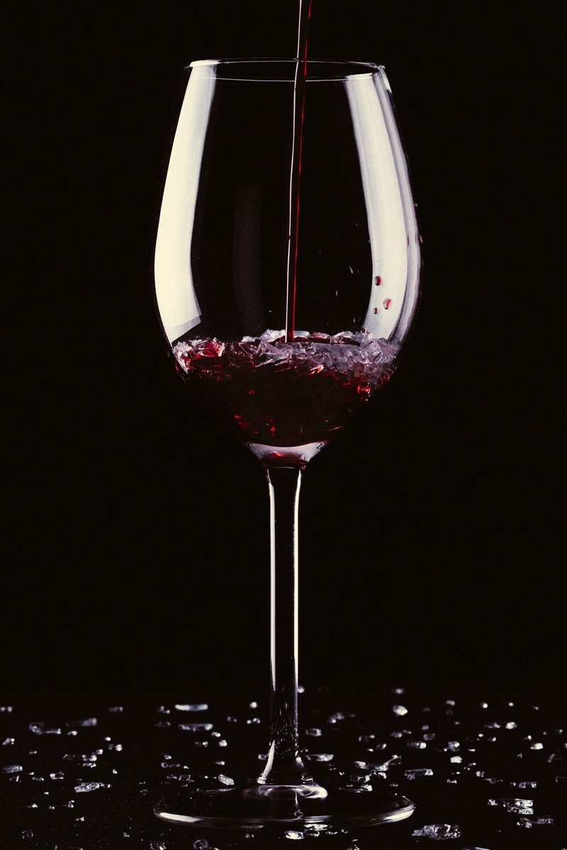 black background, wine bottle, red wine, beverage, refreshment, wet, 2K, splash, liquor, wine glass, bottle, food, poured, merlot, drink, wine, no people