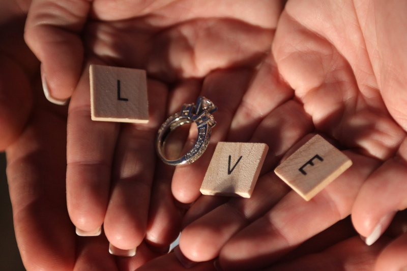 form, wedding, happy, romantic, one person, tile, romance, stud, hand, gift, indoors, spirituality, v, l, body part, close-up, scrabble, ring, e, adult
