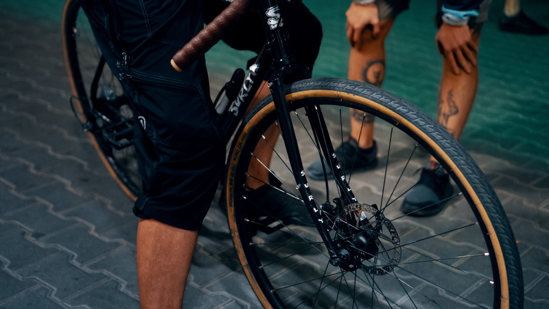 outdoors, city, vehicle, wheel, riding, leisure activity, tire, mode of transportation, disc brake, human limb, body part, 5K, cycling, men, human body part