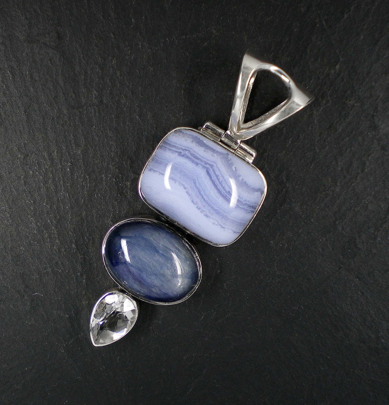 Trailers, studio shot, no people, chalcedony, kitchen utensil, blue, Gems, table, silver jewelry, metal, transparent, violet, black background, wealth