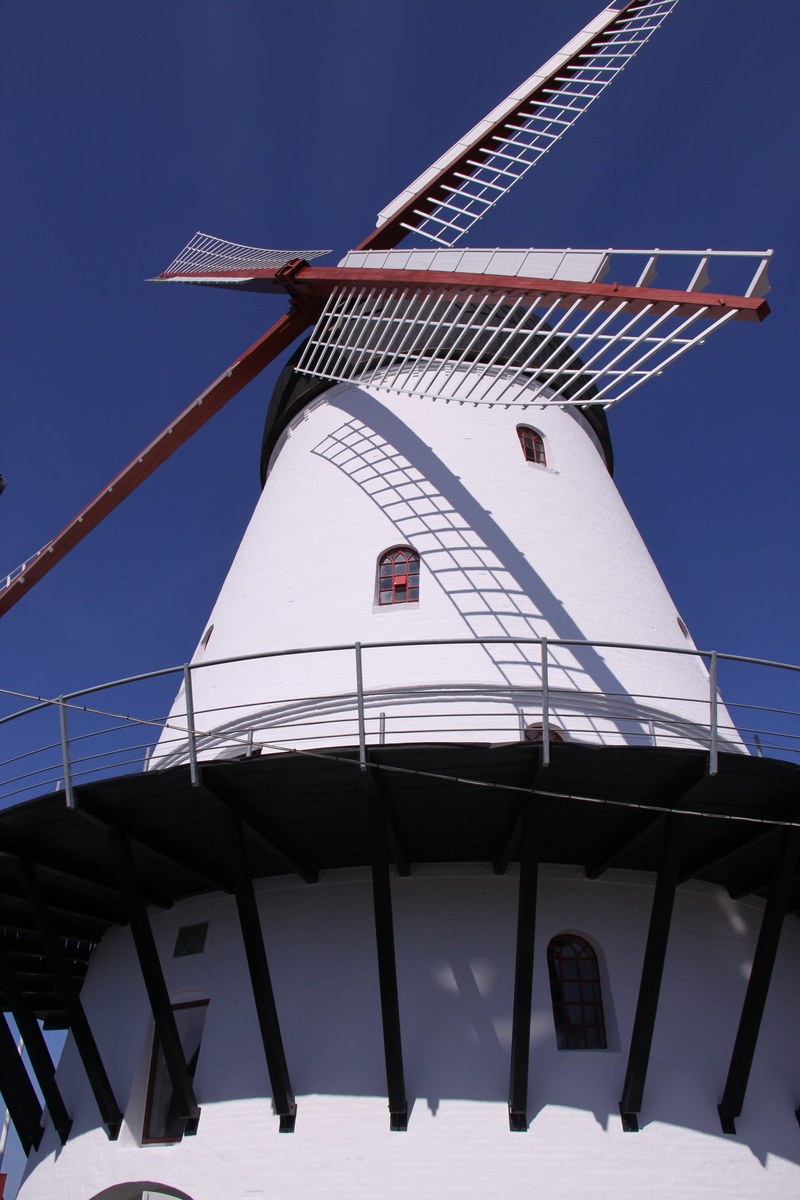 building exterior, renewable energy, day, traditional windmill, building, white color, outdoors, alternative energy, built structure, clear sky, Mill, low angle view