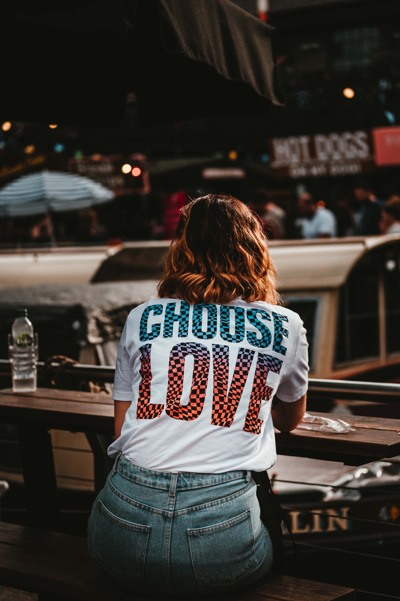 quote, girl, hair, brown hair, fashion, lady, architecture, leisure activity, shirt, sitting, women, standing, slogan, three quarter length, rear view