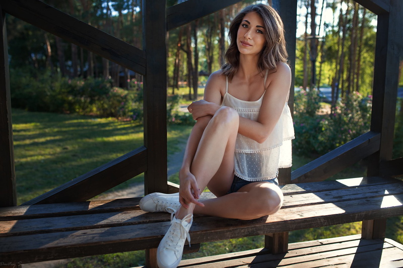 sneakers, hairstyle, front view, outdoors, full length, women, adult, day, young adult, looking at camera, white, contemplation, smirk, wood - material