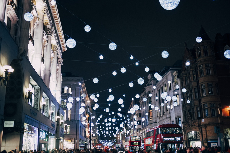 night, city, street market, incidental people, city life, store, building exterior, outdoors, illuminated, lights, built structure, shopping, lighting equipment