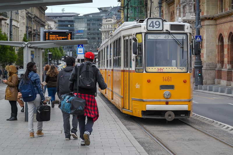 lifestyle, station, day, urban Scene, real people, europe, yellow, adult, women, rail transportation, electric, life, capital, tramlines, city street, mode of Transport