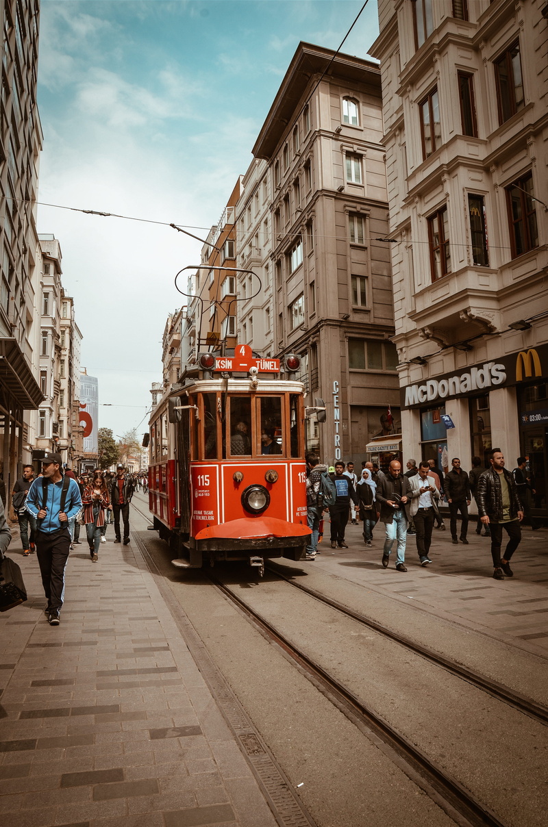 men, travel, building, mode of transportation, city, tourism, railway, track, town, pavement, railroad track, tram lines, building exterior, locomotive