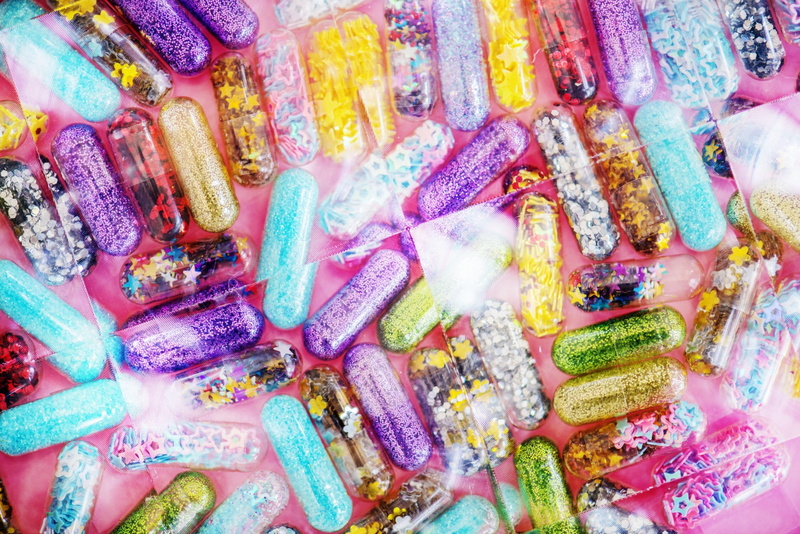 pill, care, glitter, backgrounds, choice, retail, container, glittering, pharmacy, entertainment, party, glow, large group of objects, pretty, girly, background