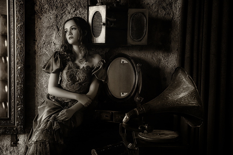 young adult, lifestyles, hairstyle, looking into the distance, dark hair, gramophone, real people, clothing, young women, music, home interior, adult, one person