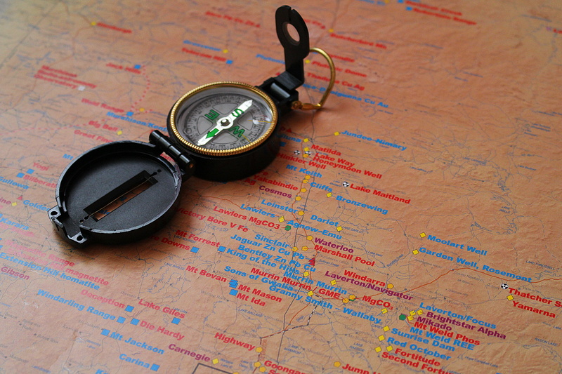 cartography, wood - material, north, table, no people, travel, gold card, accuracy, black, journey, compass, still life, close-up, topography, navigational compass