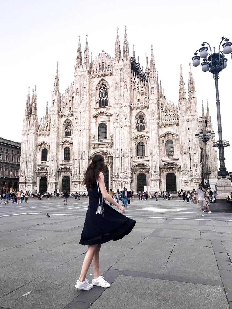 building, full length, one person, hairstyle, city, tourism, outdoors, place of worship, milano, architecture, real people, street, spirituality, italy