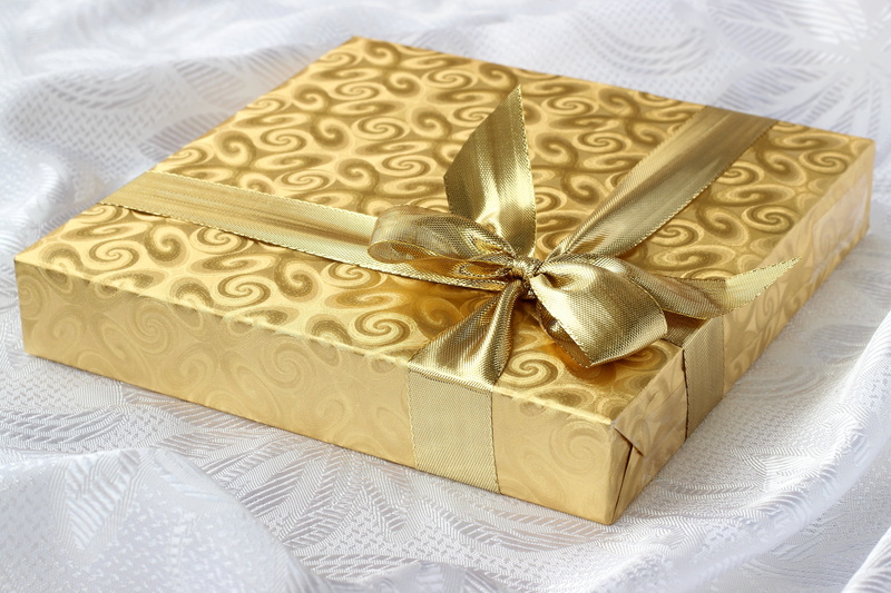 luxury, printed, gold, love, indoors, package, year, bow, high angle view, recreation, no people, wrapping paper, birthday, box - container, gift, christmas present