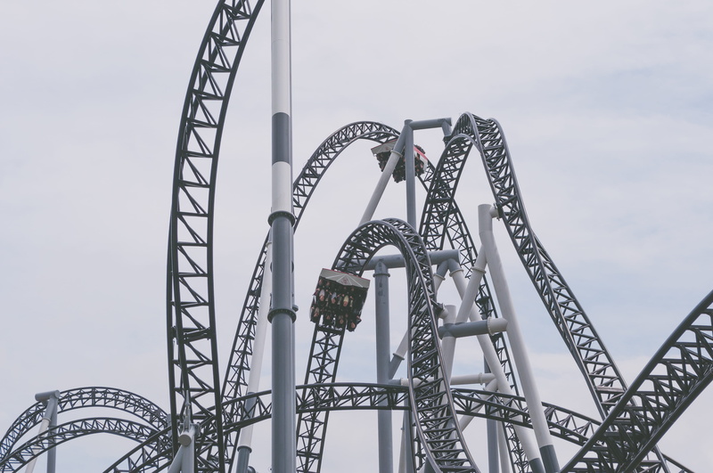 low angle view, excitement, loop, enjoyment, alloy, no people, blue, theme park, arts culture and entertainment, fun, roller, sky, steel, amusement park