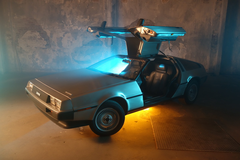 dmc, parking lot, vehicle, lighting equipment, vintage, retro styled, parked, automobile, transportation, garage, car, night, parking, time machine, wall - building feature