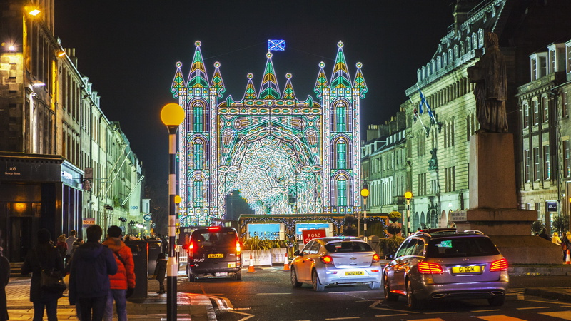 building exterior, edinburgh, travel, night, 5K, city, motion, christmas market, group of people, night view, traffic, men, land vehicle, transportation